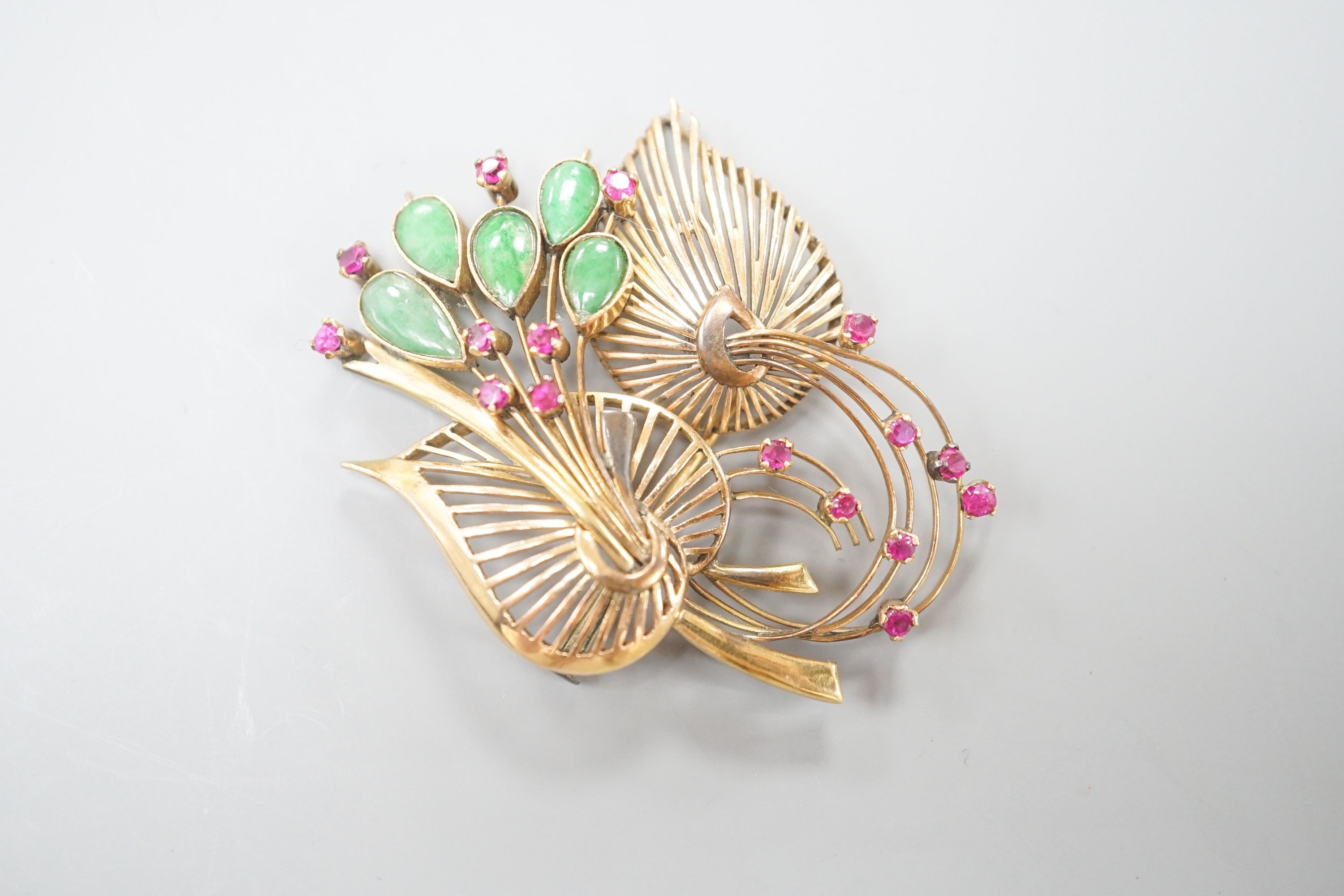 A yellow metal, jade and gem set floral spray brooch, 53mm, gross weight 13.9 grams.